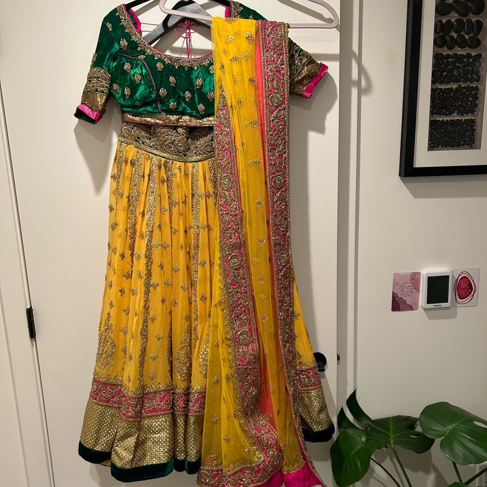 Designer Nidhi Tholia vibrant yellow Lehnga